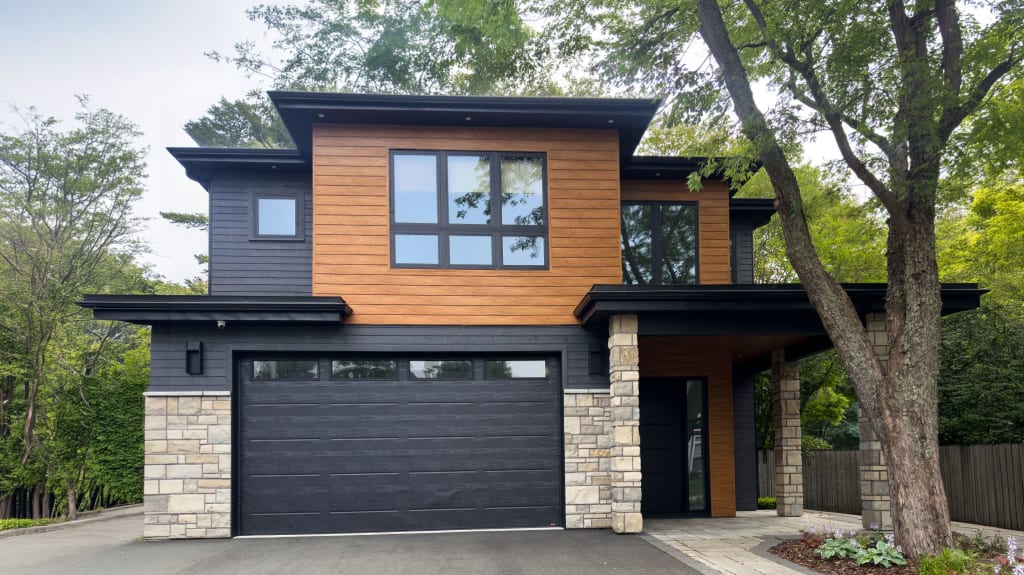 House with new exterior siding featuring brick and vinyl