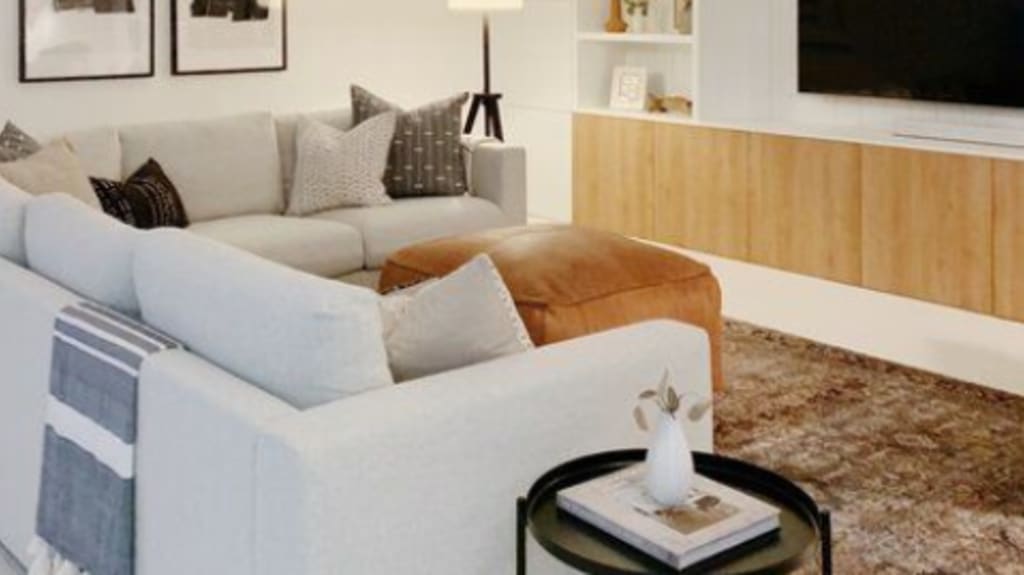 cozy basement with wall art and tv