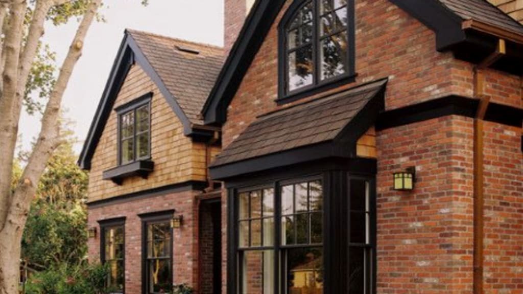 red brick house with large windows