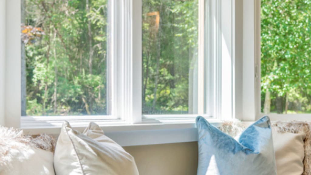 pvc window with pillows and couch