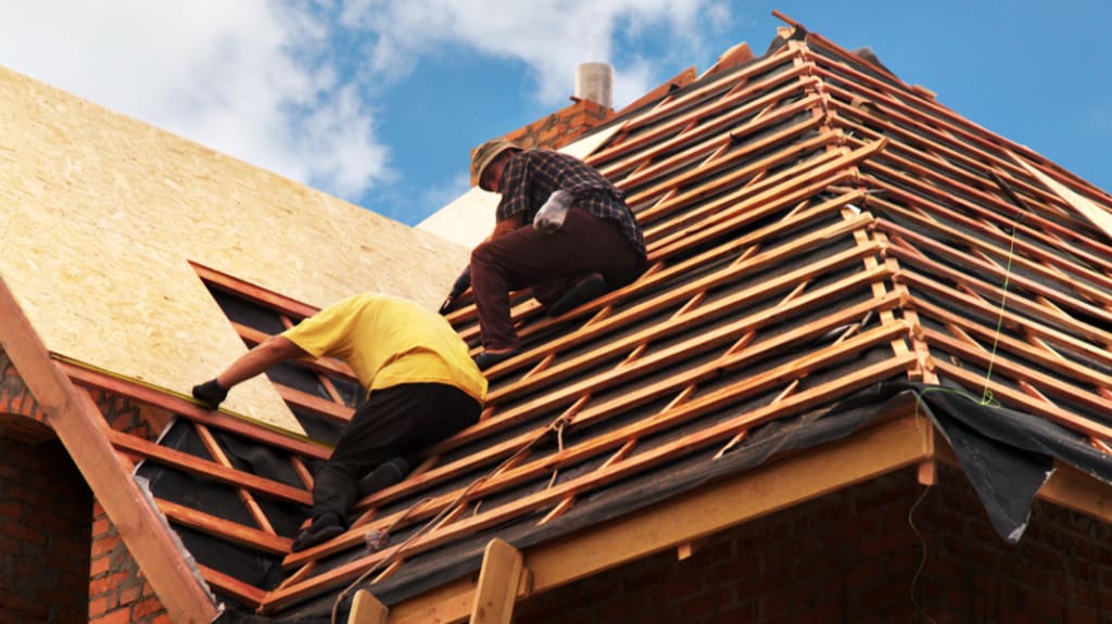 roofers installing roof
