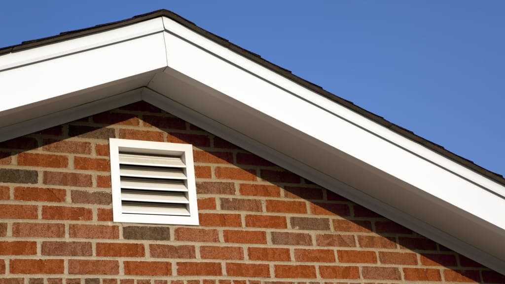 Roof vent on a brick house