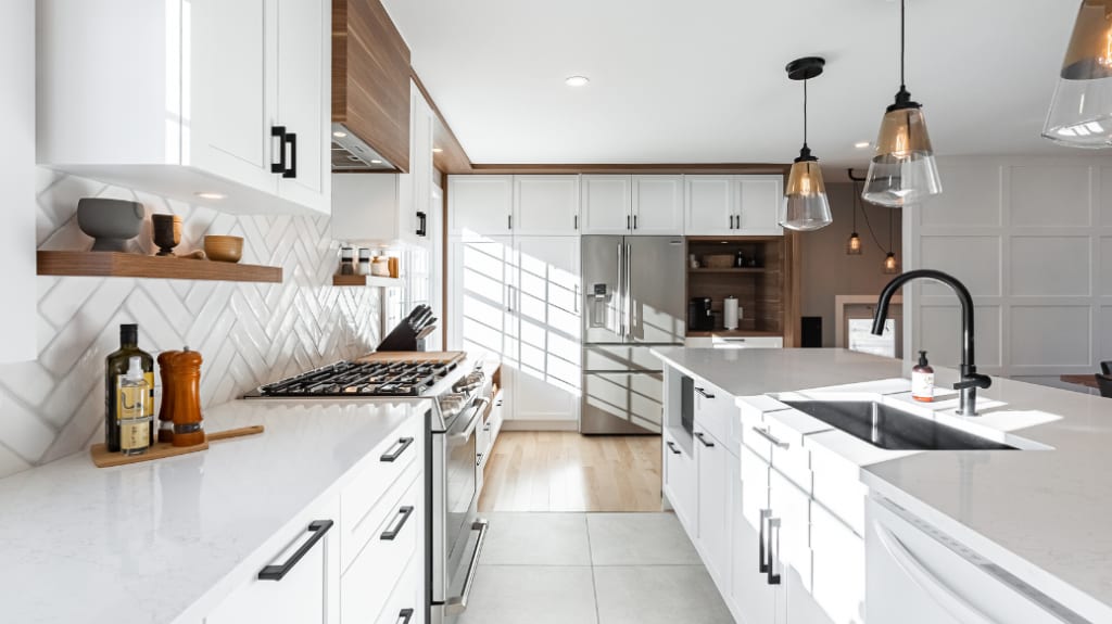 A bright white contemporary kitchen renovation with wood accents