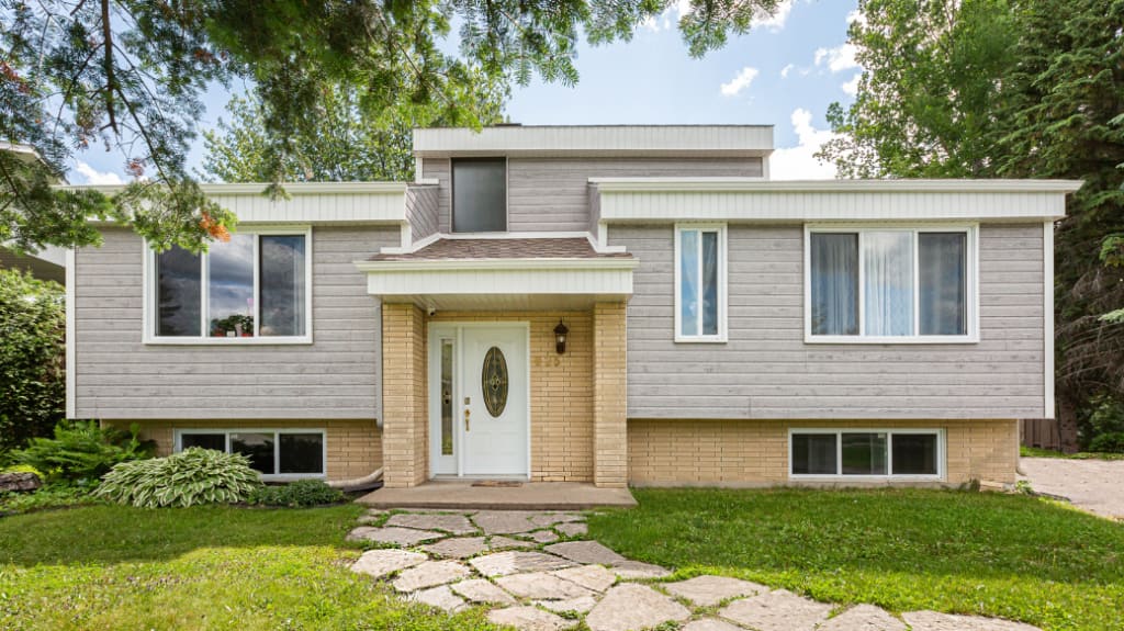 front view of a house with modern CanExel siding