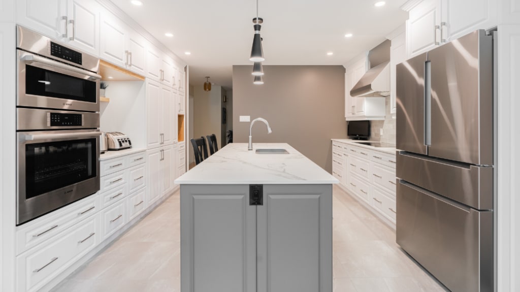 Spacious classic kitchen remodel with white and grey cabinets