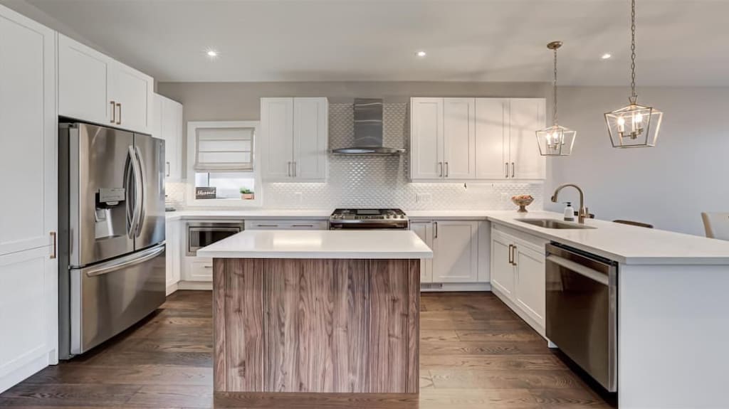 Bright white kitchen with wooden square island