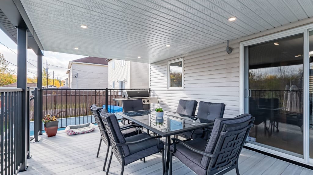 back porch with outdoor dining table