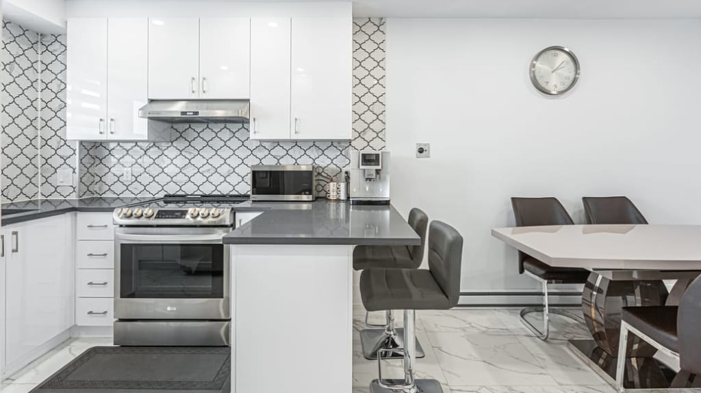 white and grey contemporary kitchen and dining room