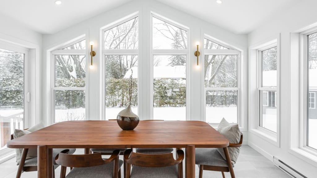 4-season veranda with wood dining table