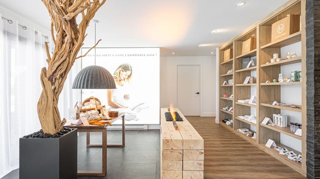 Abundance of storage and products balanced with open space and decorative elements like wood