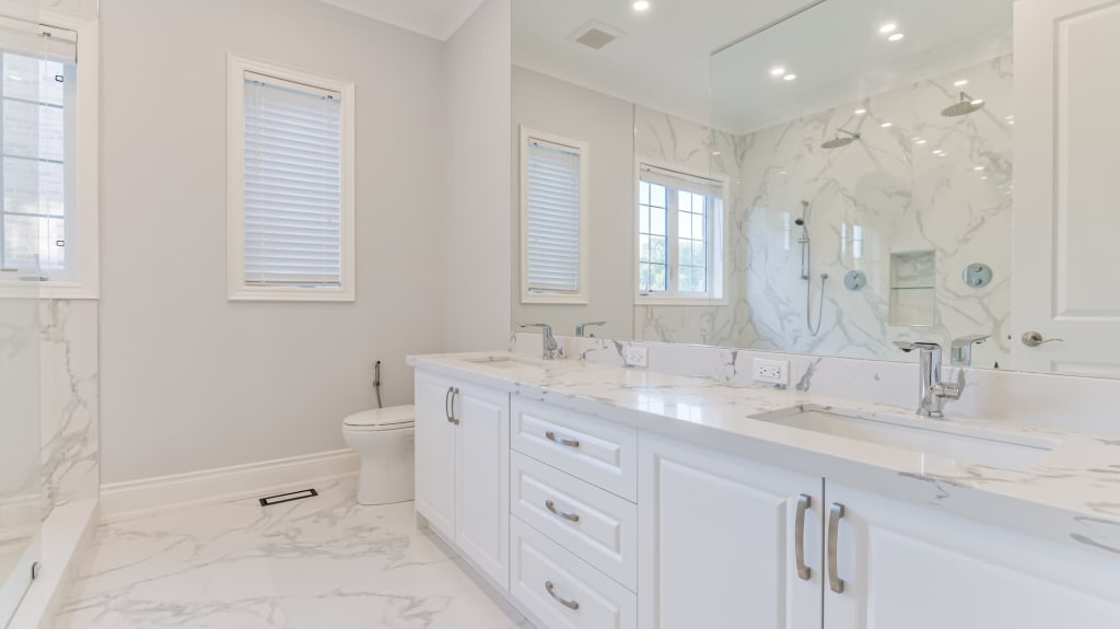 modern renovated bathroom with white vanity