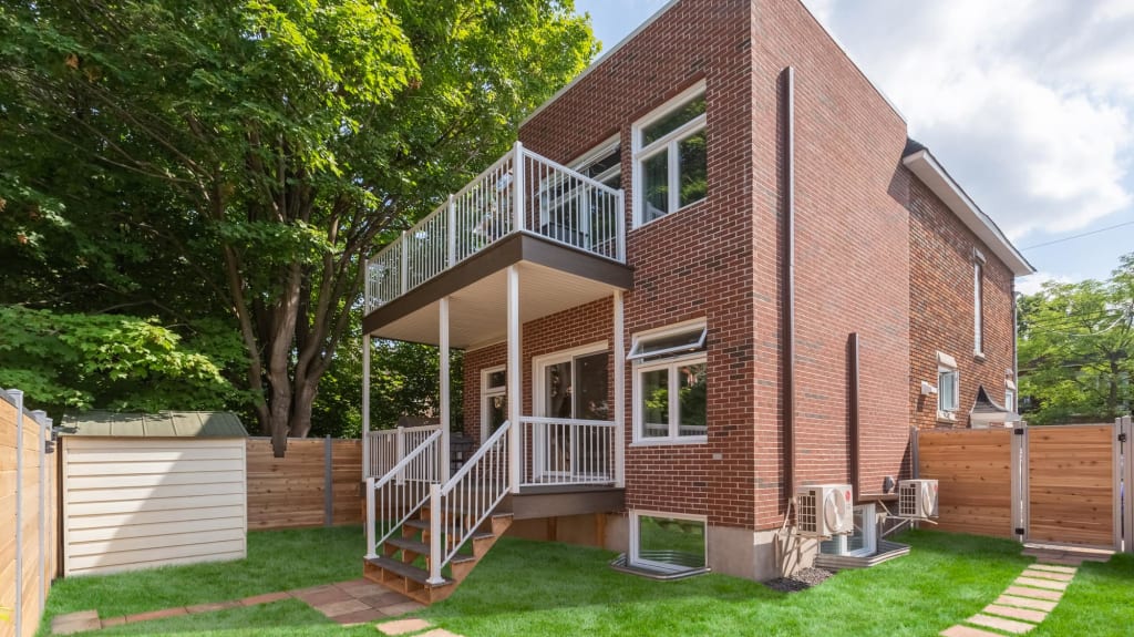 home addition - rear view with red brick siding