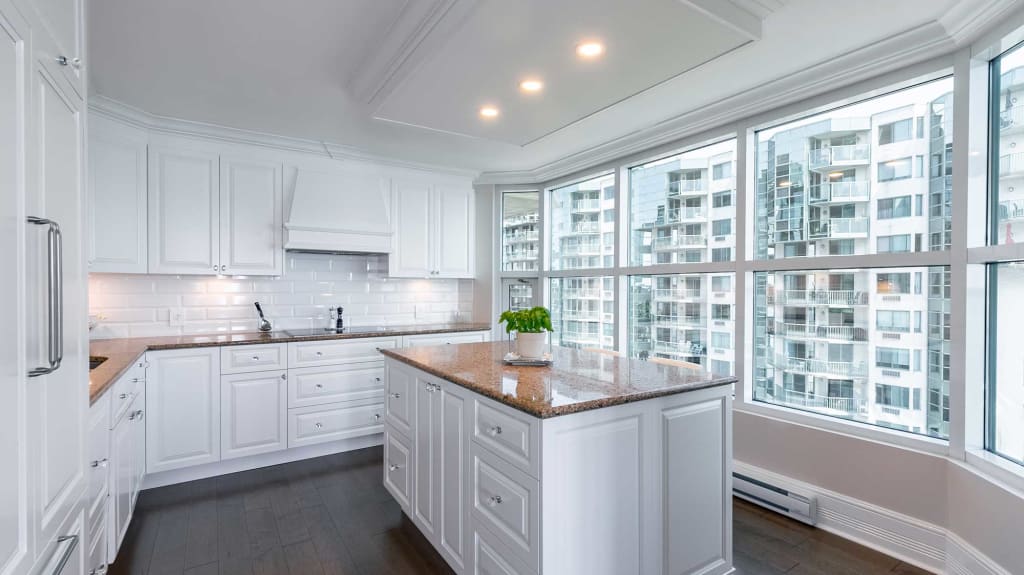 white kitchen cabinets with granit countertop