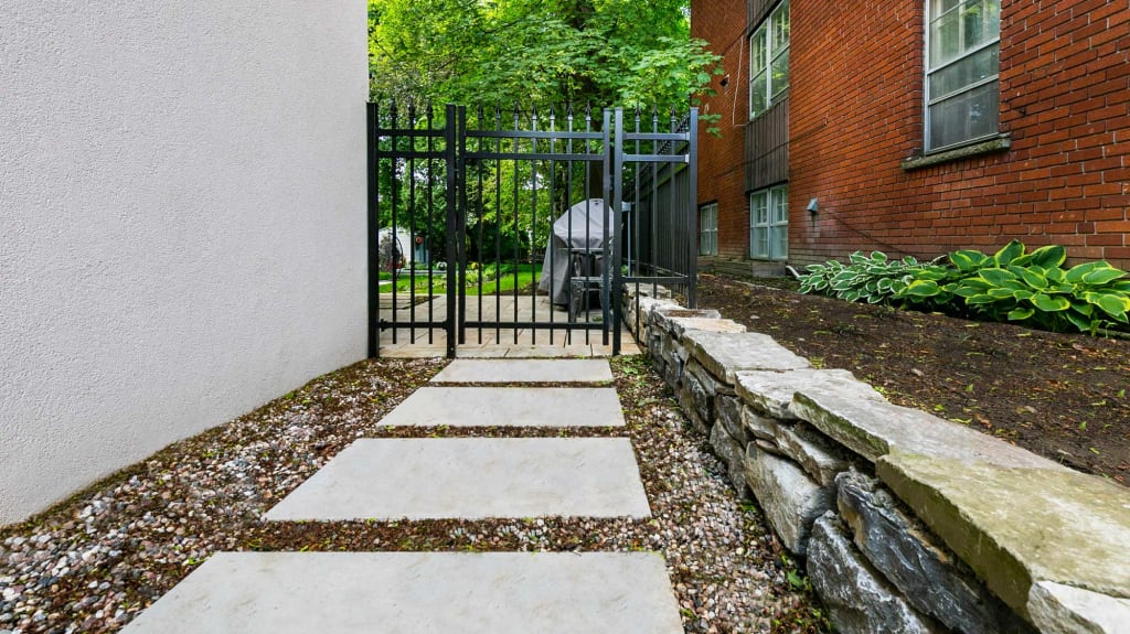natural stone wall (party-wall) with garden slab