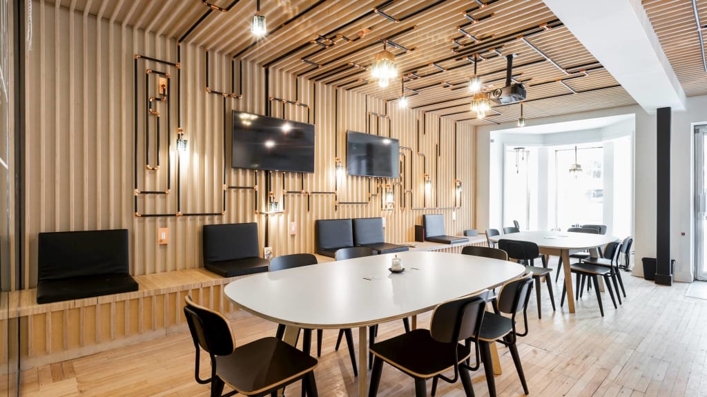 cofee shop design with beige tables and black chairs