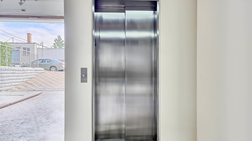 Elevator with stainless doors closed