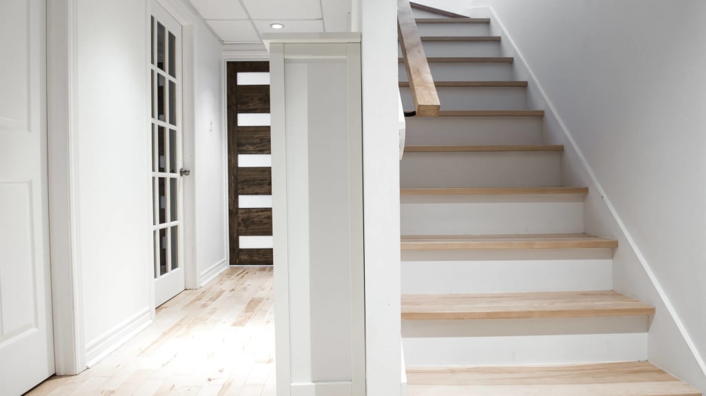 basement staircase and natural hardwood floor