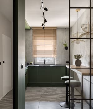 Kitchen enclosed behind a door and a glass wall