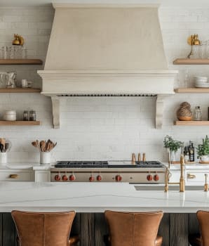 Organic kitchen with white stone wall, built-in plaster hood and open shelves