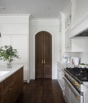 Arch-shaped wooden pantry door 