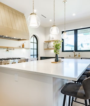 Seaside-style kitchen with sandy accents and large white countertop