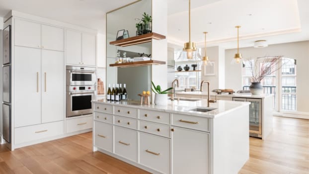 White double island with gold accents in a classic modern kitchen