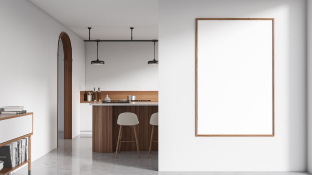 White kitchen with grey concrete floor and arched door 