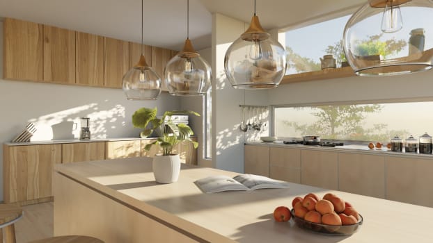Designer glass fixtures and bay windows for a welcoming interior