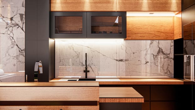 Large-vein backsplash, black accents, sink and lighting features
