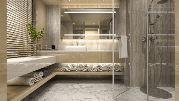 Salle de bain luxueuse avec grande vanité flottante en coin