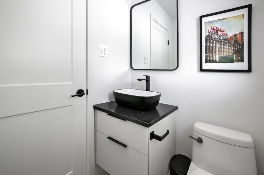 Modern bathroom with black and white sink