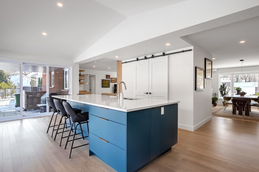 Spacious kitchen with central island opening onto the dining room