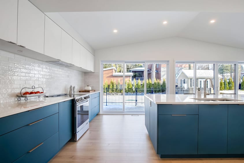 Kitchen with cathedral ceiling and recessed lighting