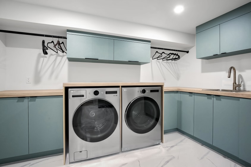 Laundry room with sink and drying rack