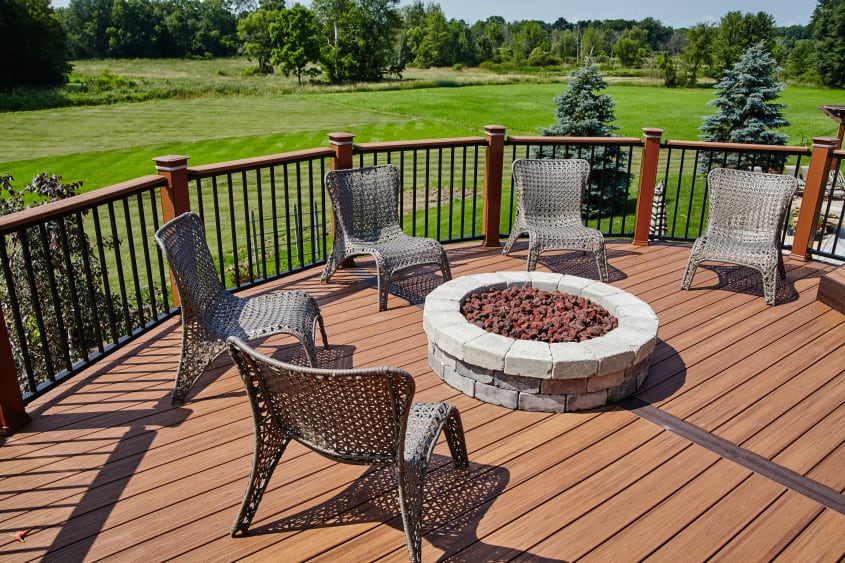 Wooden deck with fire pit and chairs