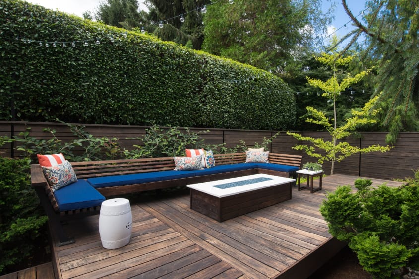 Modern wooden deck railing with furniture