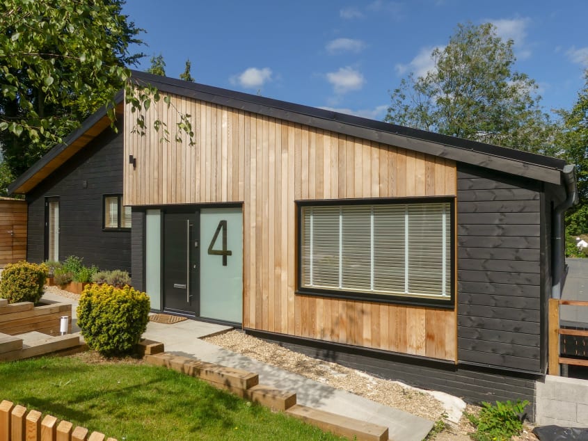 Modern style home with natural light wood siding