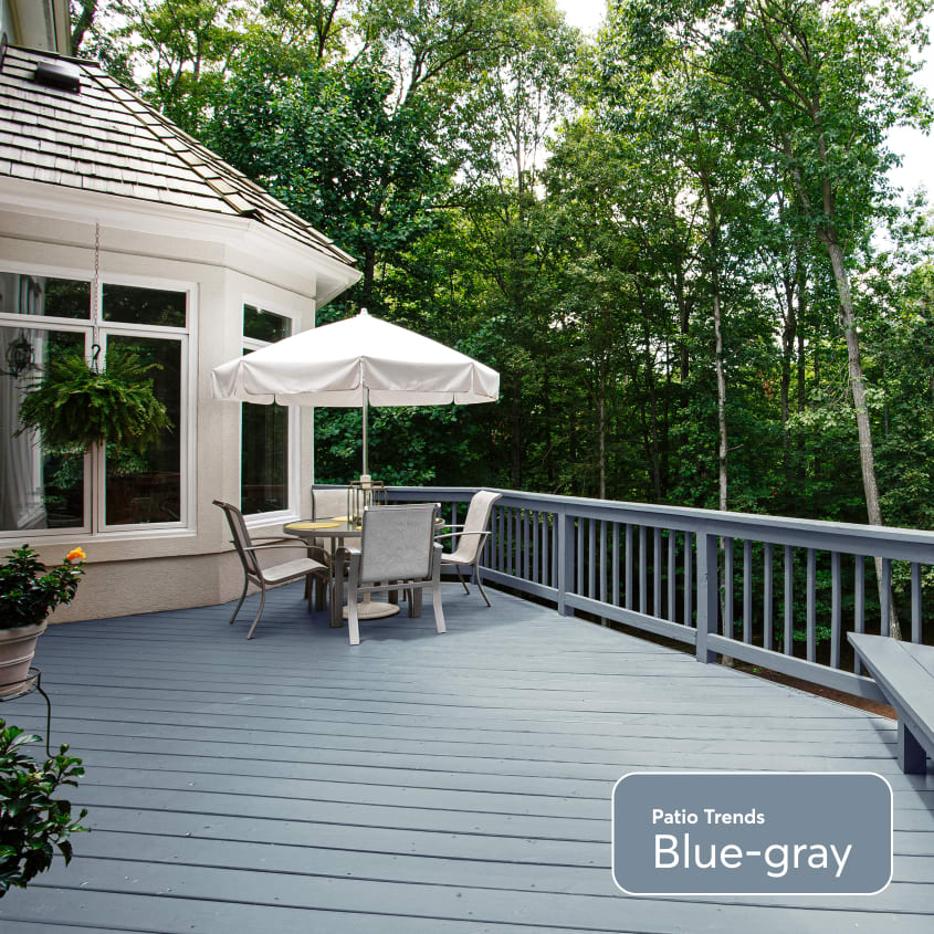 Blue-gray large wood patio with rail