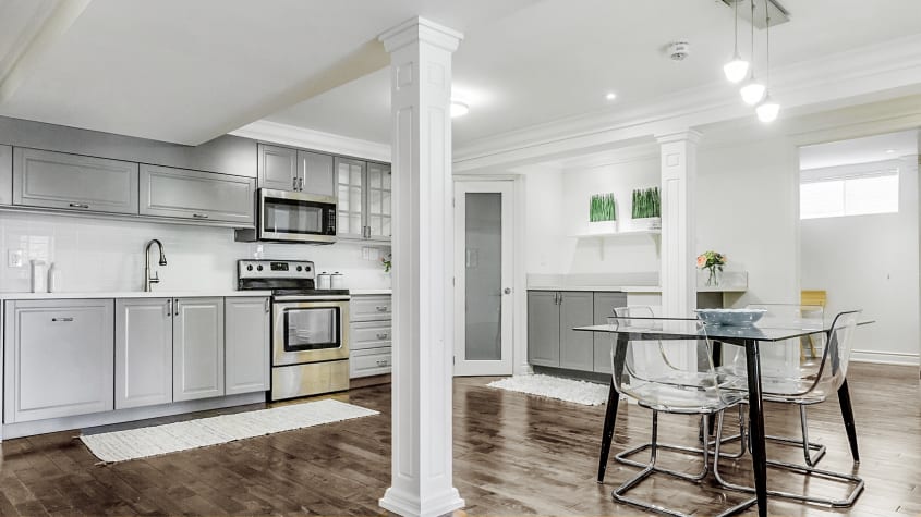 Open-concept basement kitchen and dining room