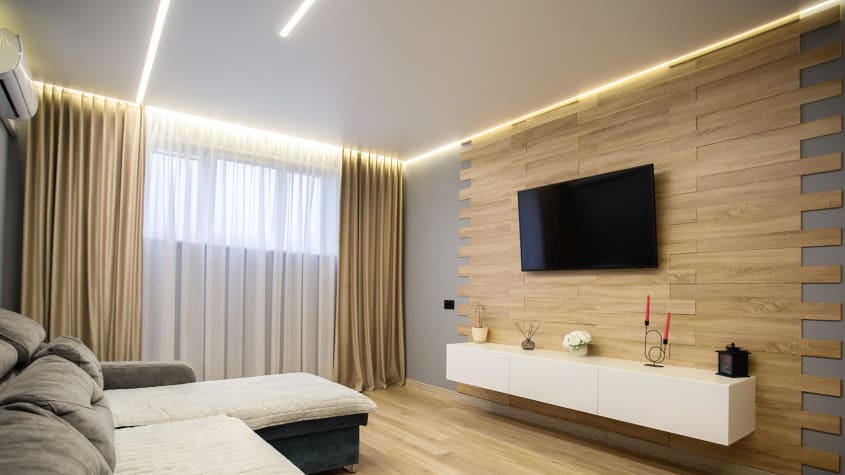 Modern basement family room with wall-mounted TV