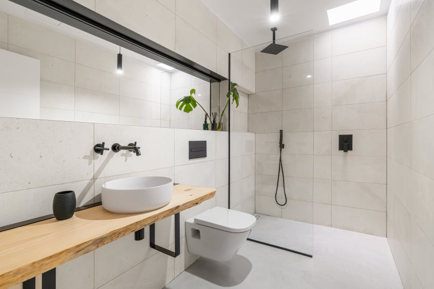 Natural bathroom materials: composite stone, terrazzo, and large-format ceramic