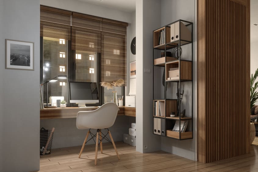 Bureau à la maison le soir avec comptoir flottant en bois et chaise à coque en résine, meuble de rangement mural en métal et mur en lattes de bois