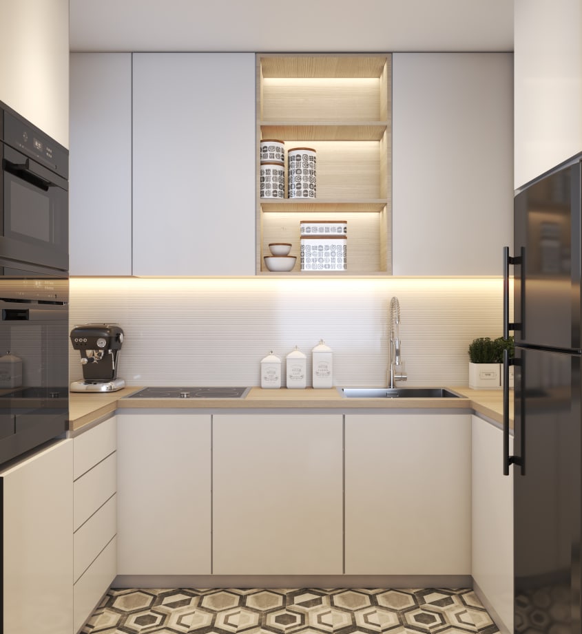 Cuisine blanche à électroménagers noirs, plancher à motifs hexagonaux, dosseret illuminé par éclairage indirect