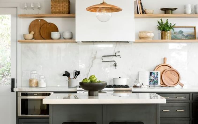 Black and white kitchen with white marble slab as a backsplash
