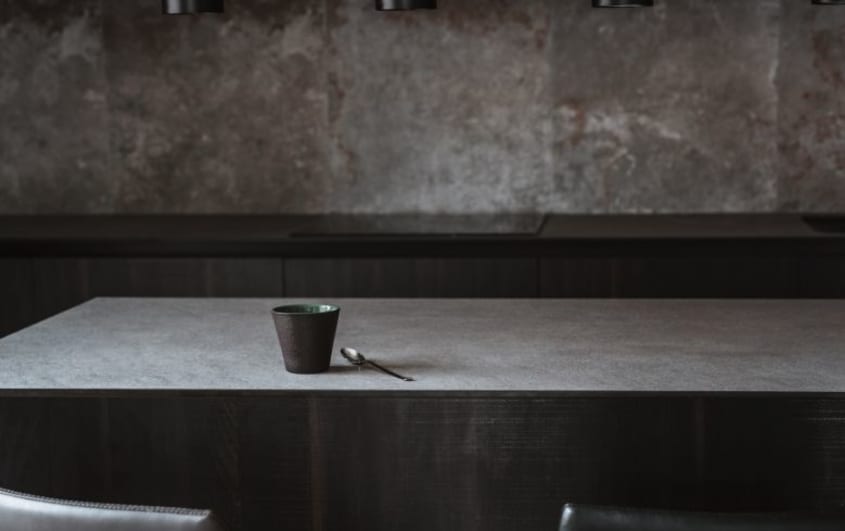 Dark kitchen with dark concrete countertop