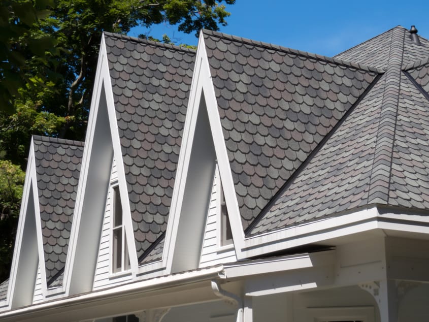 Octagonal asphalt shingle roof on three gables