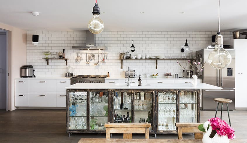 white-kitchen-with-salvaged-furniture-converted-into-an-island